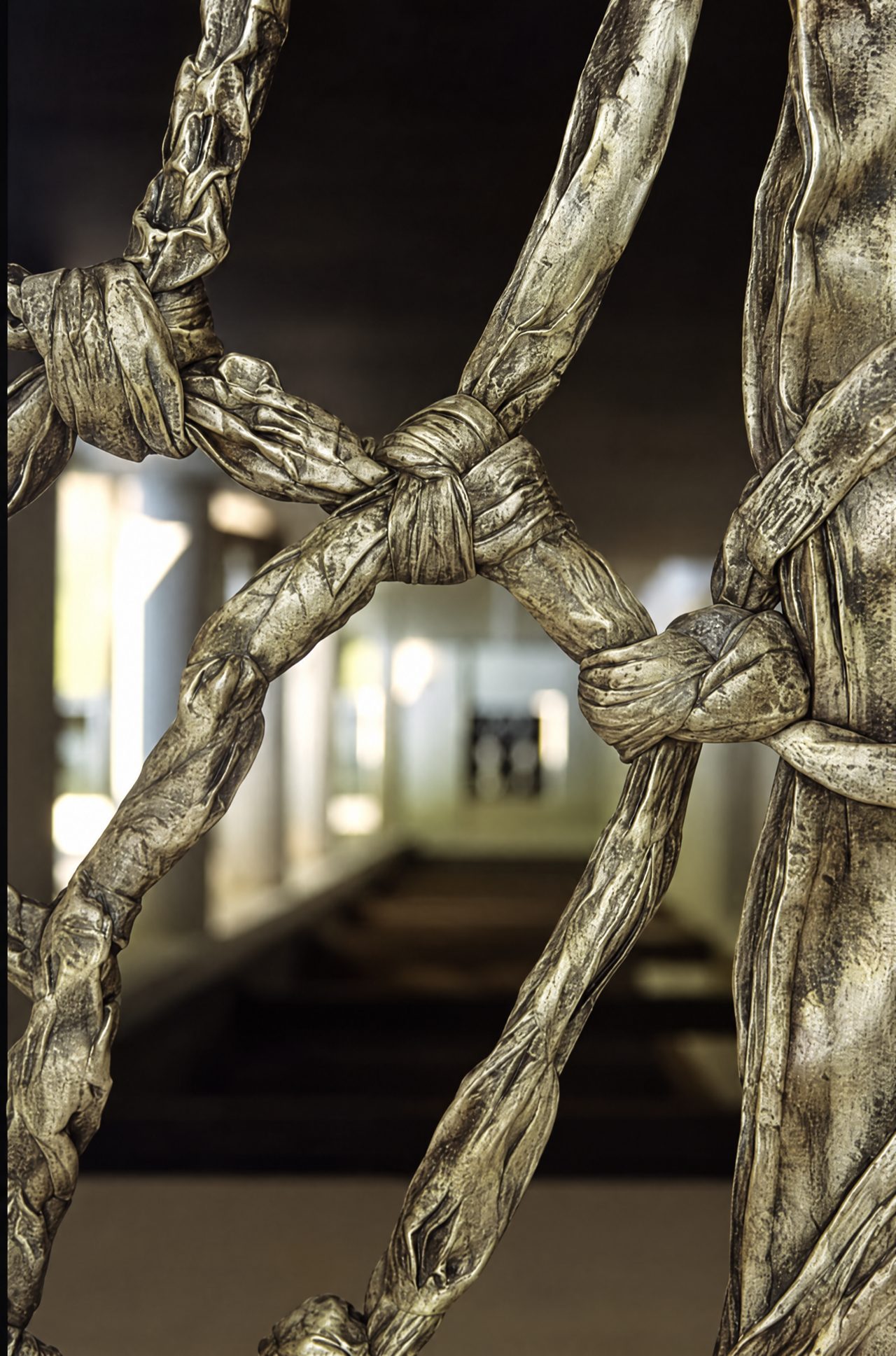 Detail of a portion of one of the Gate panels, sand-cast in solid patinated aluminium from foam sheets tied by the artist