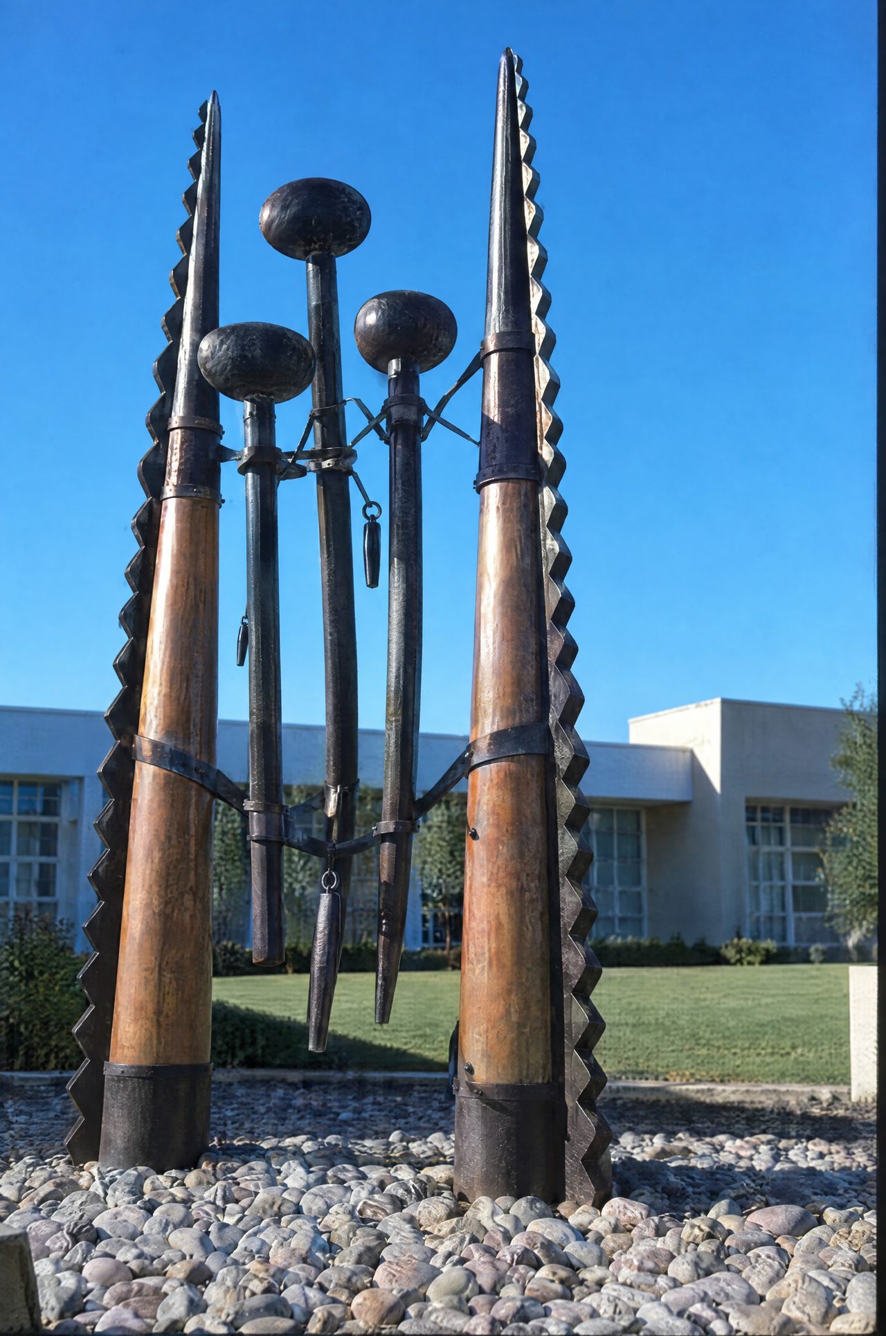 Rack at installation: copper-plated steel spires against a blue sky, by David Hamilton
