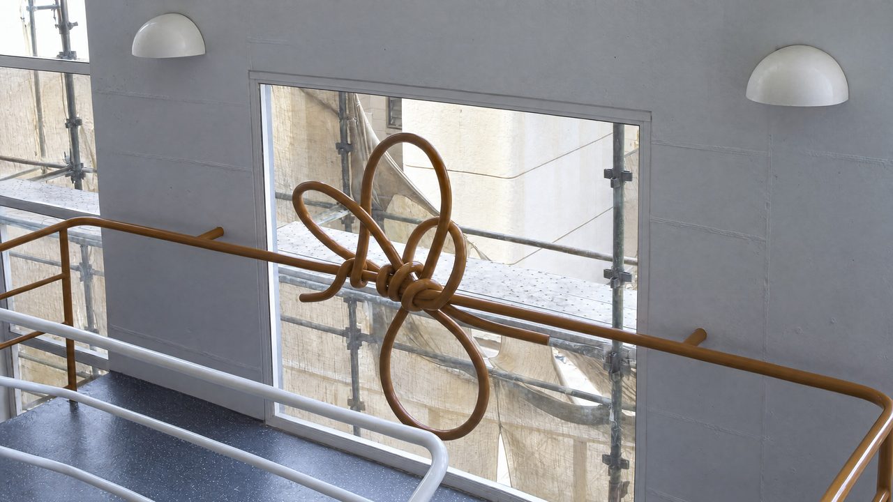 Railing, a red painted steel gate railing looped into a knotted floral pattern at Launceston General Hospital, by David Hamilton