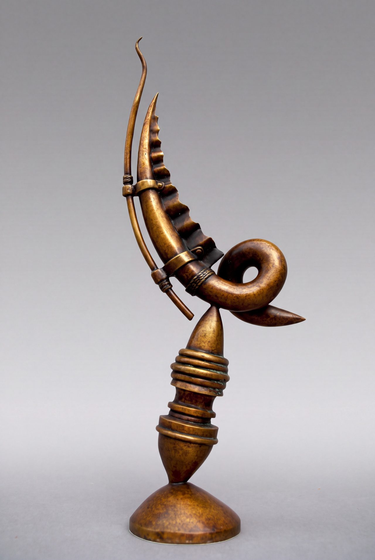 Xiphos, a bronze curved blade form banded with rings, looping into a coil above a ribbed conical base, by David Hamilton