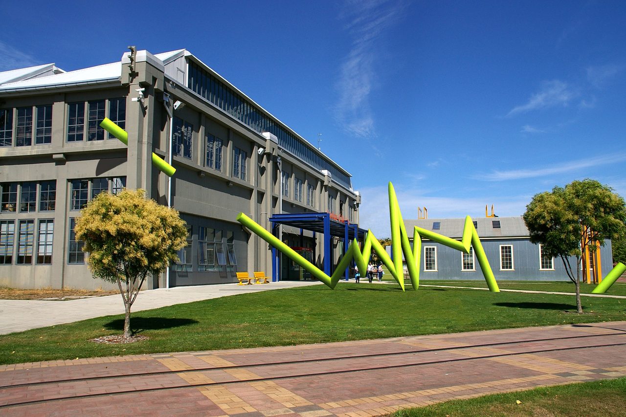 Bolt, a bright green zigzag steel sculpture on the lawn outside the Academy of the Arts building, Inveresk, by David Hamilton