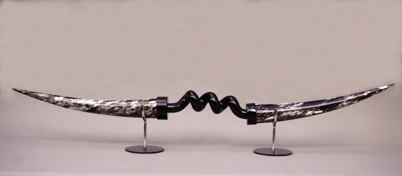 Bardiche II, a long curved marbled horn form joined at its centre by a glossy black coiled section, by David Hamilton