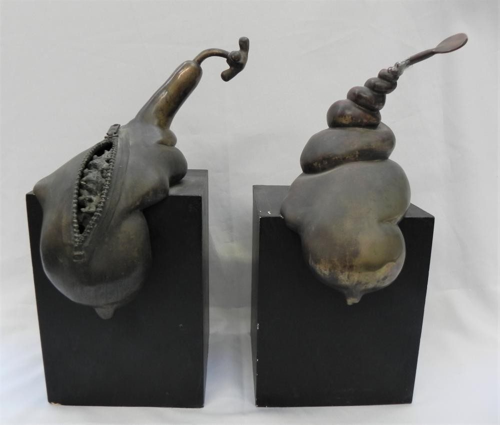 Zip and Screw, two bronze shell forms on black plinths side by side, by David Hamilton