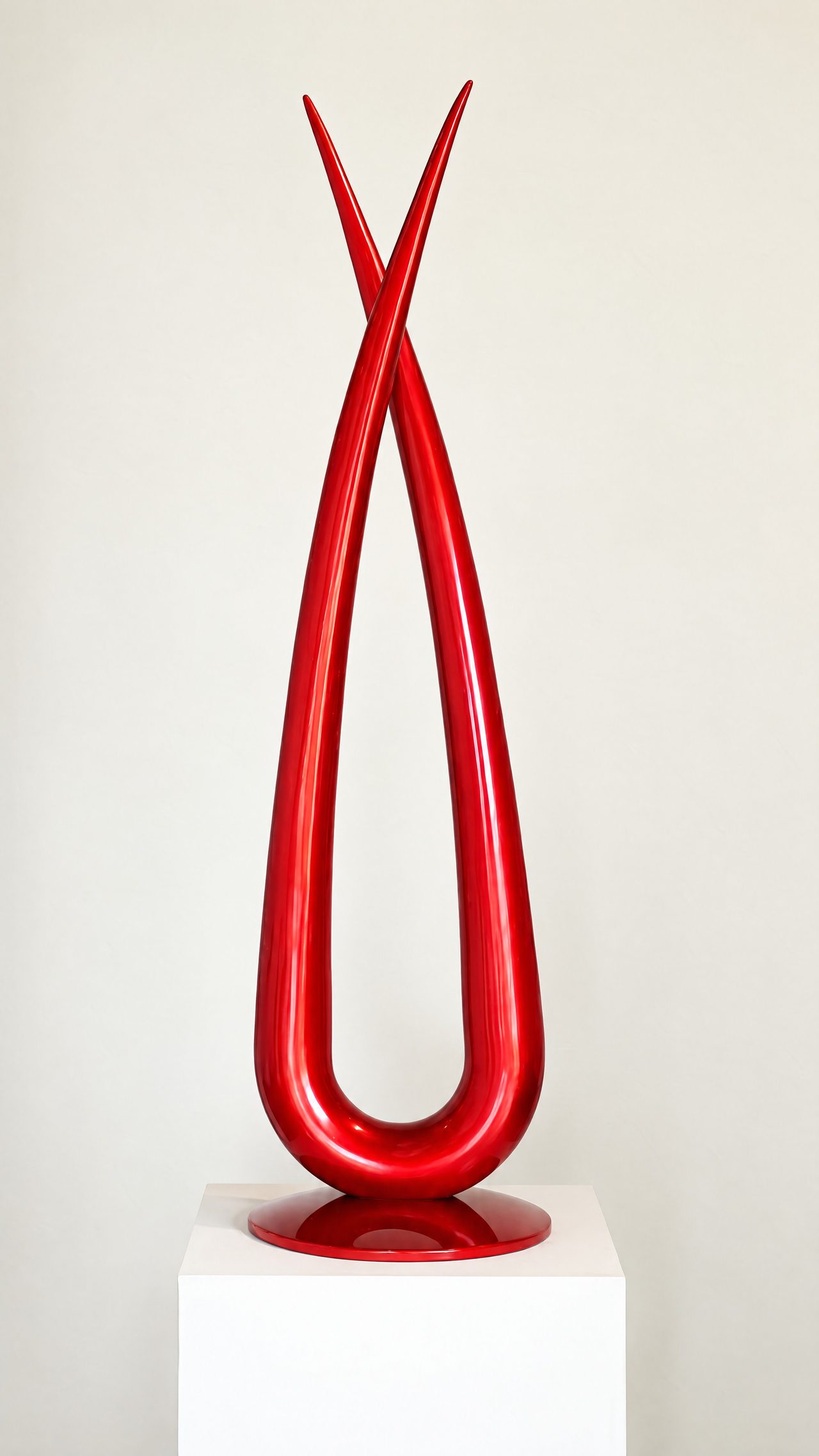 Red Vector, two glossy red painted rods crossing to a point at the top and looping into a single wide teardrop base, by David Hamilton