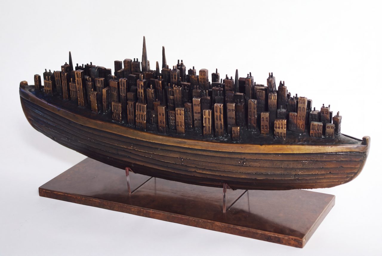 New Forest 2, a silicon bronze boat carrying a dense cluster of tall bronze towers and spires, by David Hamilton