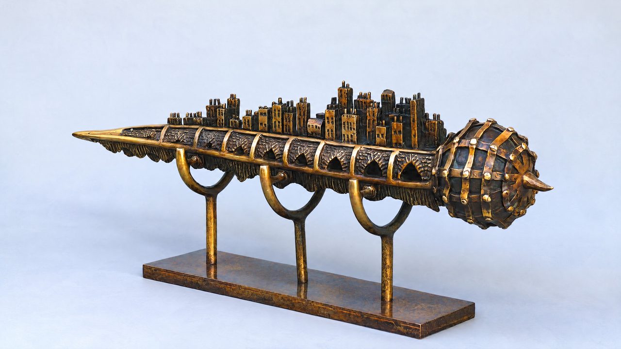 River Construct, a torpedo-like silicon bronze form with a riveted bulb at one end and a miniature city along its spine, by David Hamilton