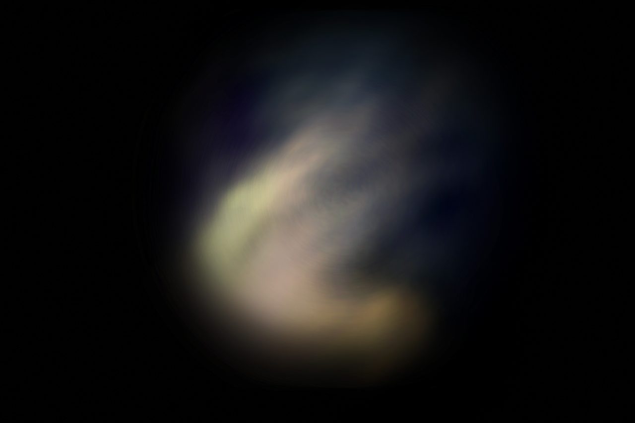 Untitled, an abstract long-exposure photographic study showing a pale curved band of light against a dark blue ground, by David Hamilton
