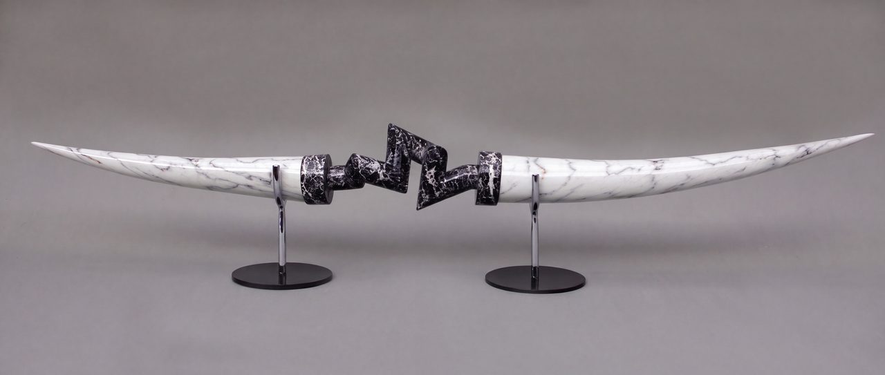 Bardiche I, a long curved white marbled horn form joined at its centre by a black marbled zigzag section, by David Hamilton