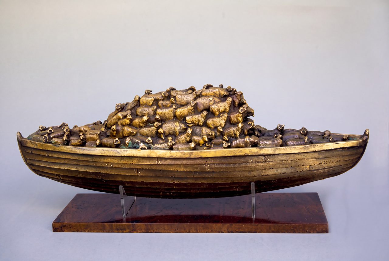Sheepship, a silicon bronze boat piled high with a flock of cast bronze sheep, by David Hamilton