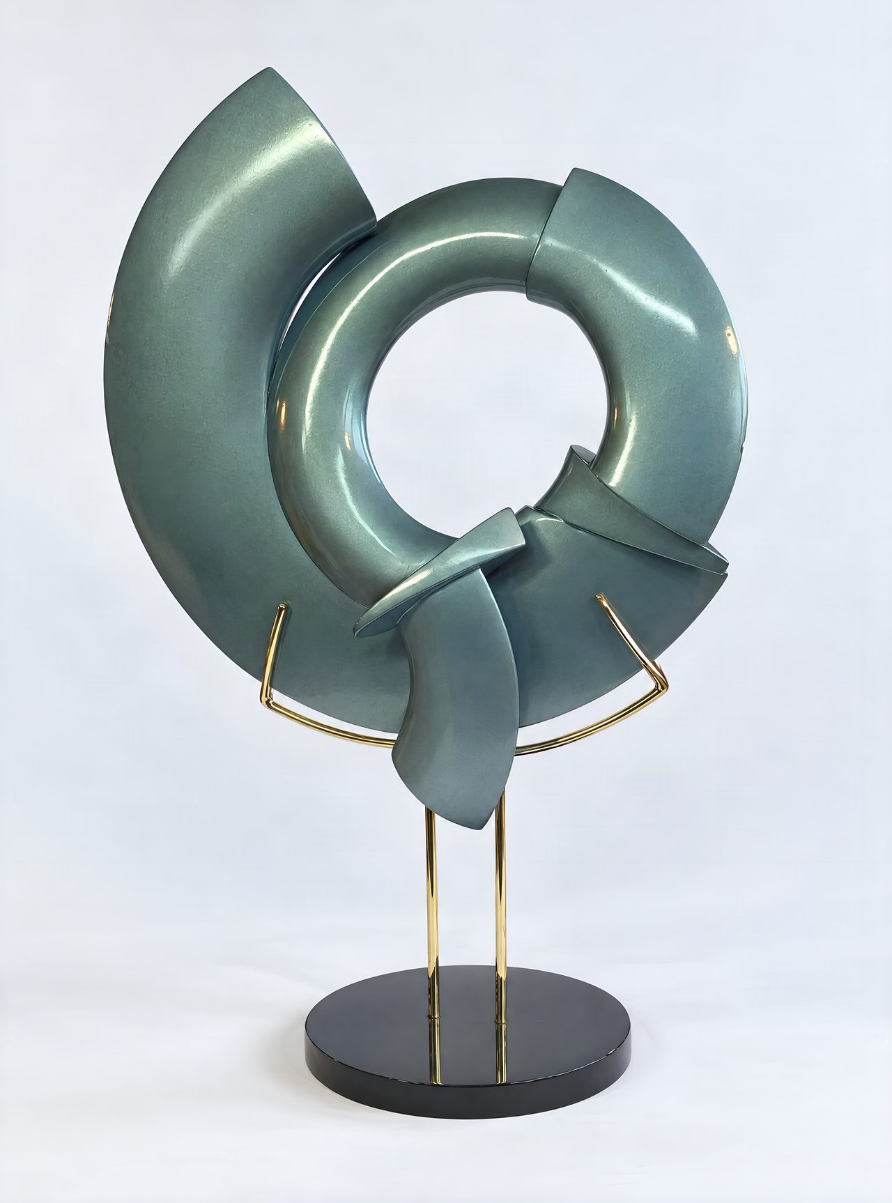 Bangle I, a broken-ring sculpture in metallic teal-green lacquer with a twisted knot at its base, mounted on a stand, by David Hamilton
