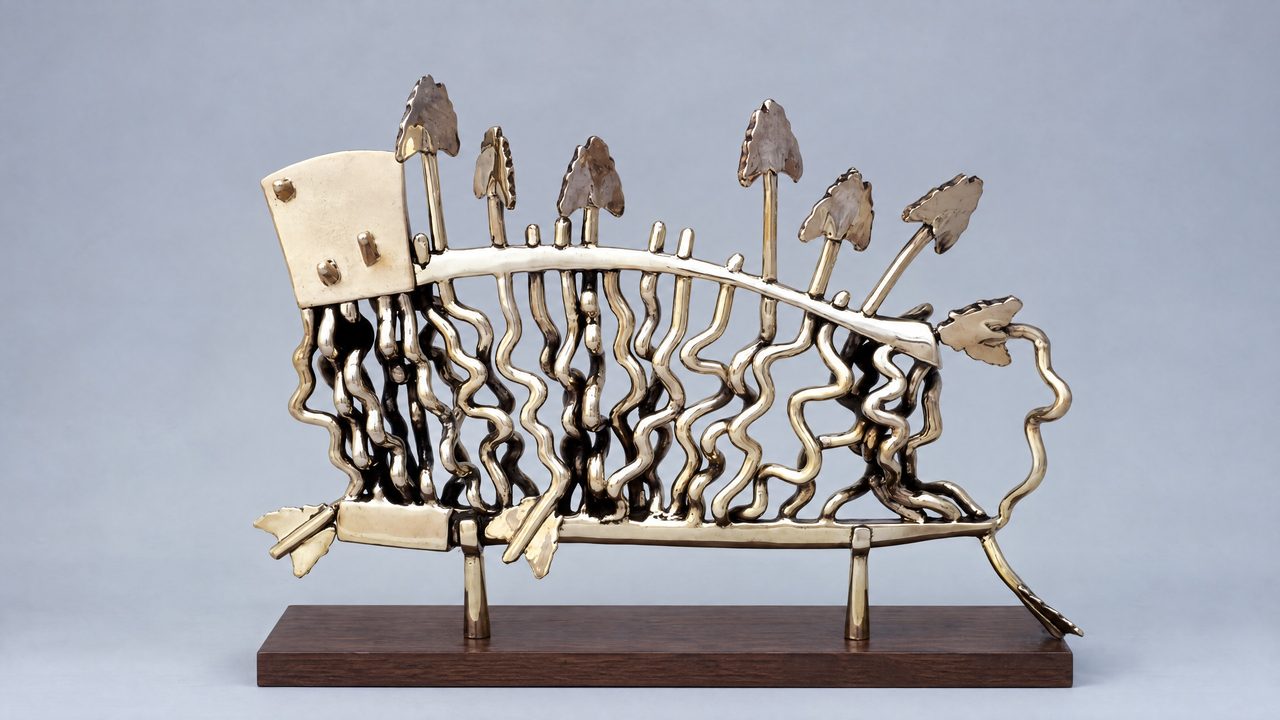 Bow, a polished bronze axe with a burst of fine wire-like spikes bristling from its head, by David Hamilton
