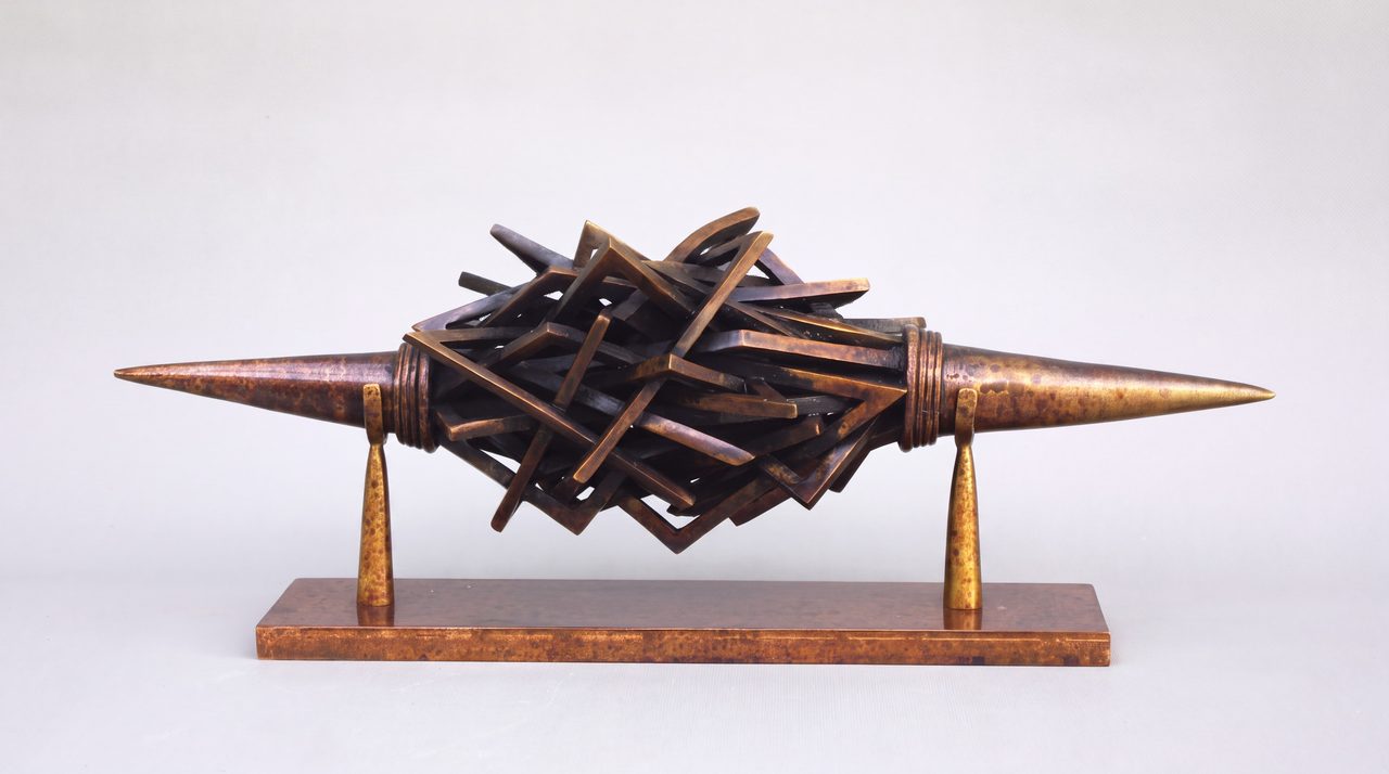 Haussmann's City, a horn-shaped silicon bronze sculpture with a tangled lattice of flat bronze planes at its centre, by David Hamilton