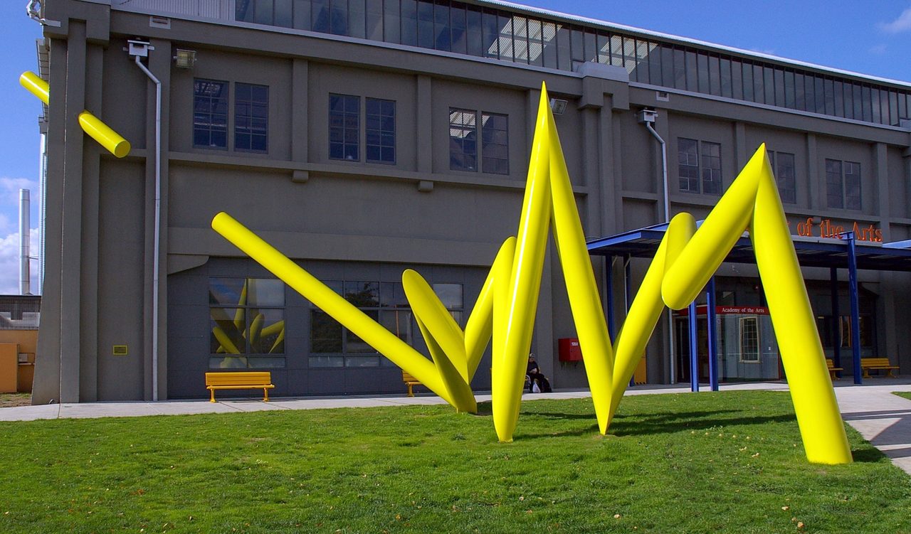 Bolt, a bright yellow zigzag steel sculpture on the lawn outside the Academy of the Arts building, Inveresk, by David Hamilton