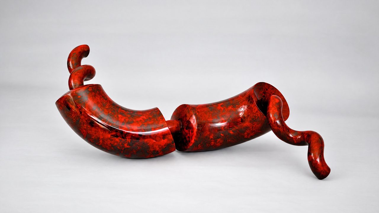 Earthbit, a mottled red-and-black painted steel rod curving through hooked bends with a small curled tip, by David Hamilton